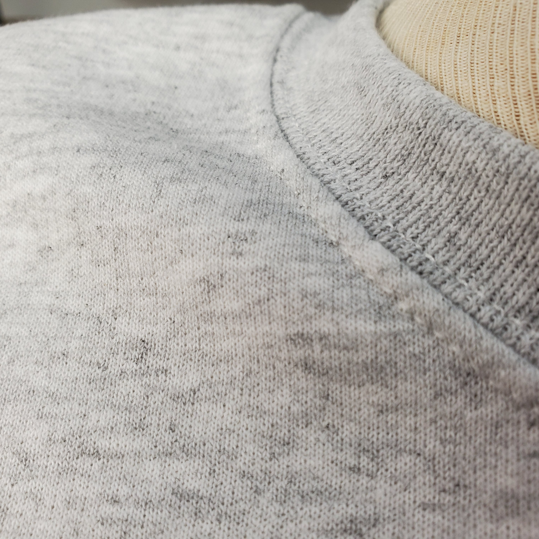 Close up view of Crew Neck - Showcase your love for Scotland in this stylish crewneck sweatshirt. Stay comfortable and warm while keeping up with the latest trends! Pair these with some biker shorts and walk the streets in style while representing Scottish pride.