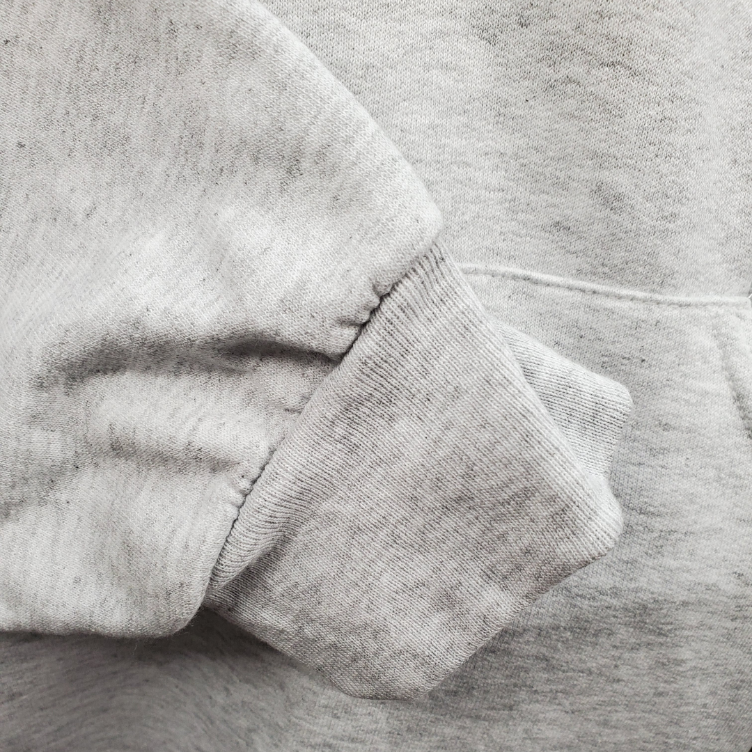 Close up of arm cuff - The Union Jack is the new black. This soft comfortable hooded sweater is perfect for those cooler nights. Stay cozy while representing your U.K. pride with this embroidered sweater.