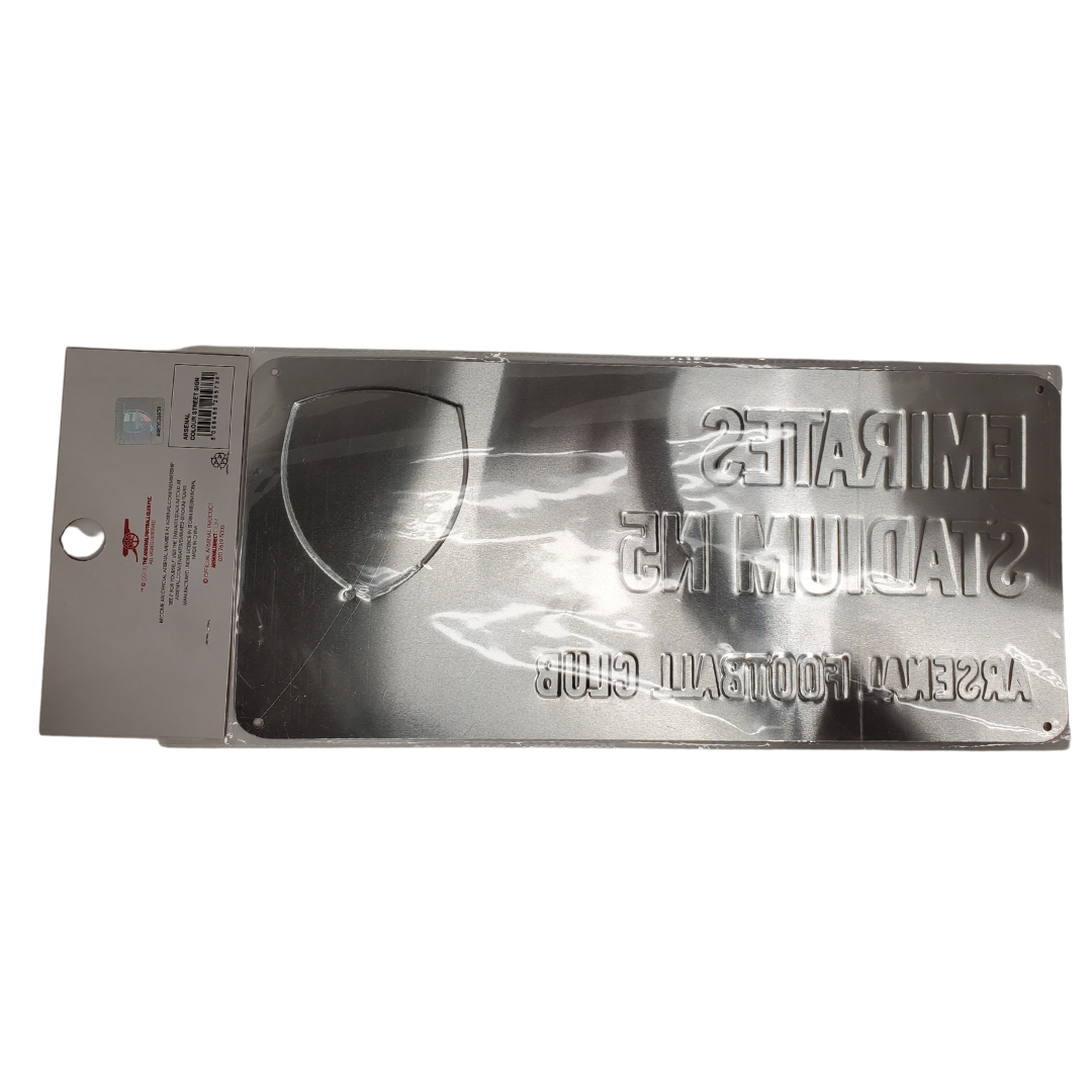 Announce your Arsenal fandom with this Emirates Stadium N5 street sign. It comes ready to hang! It is the perfect addition for your in-home bar! It measures approximately 7" x 5.5"