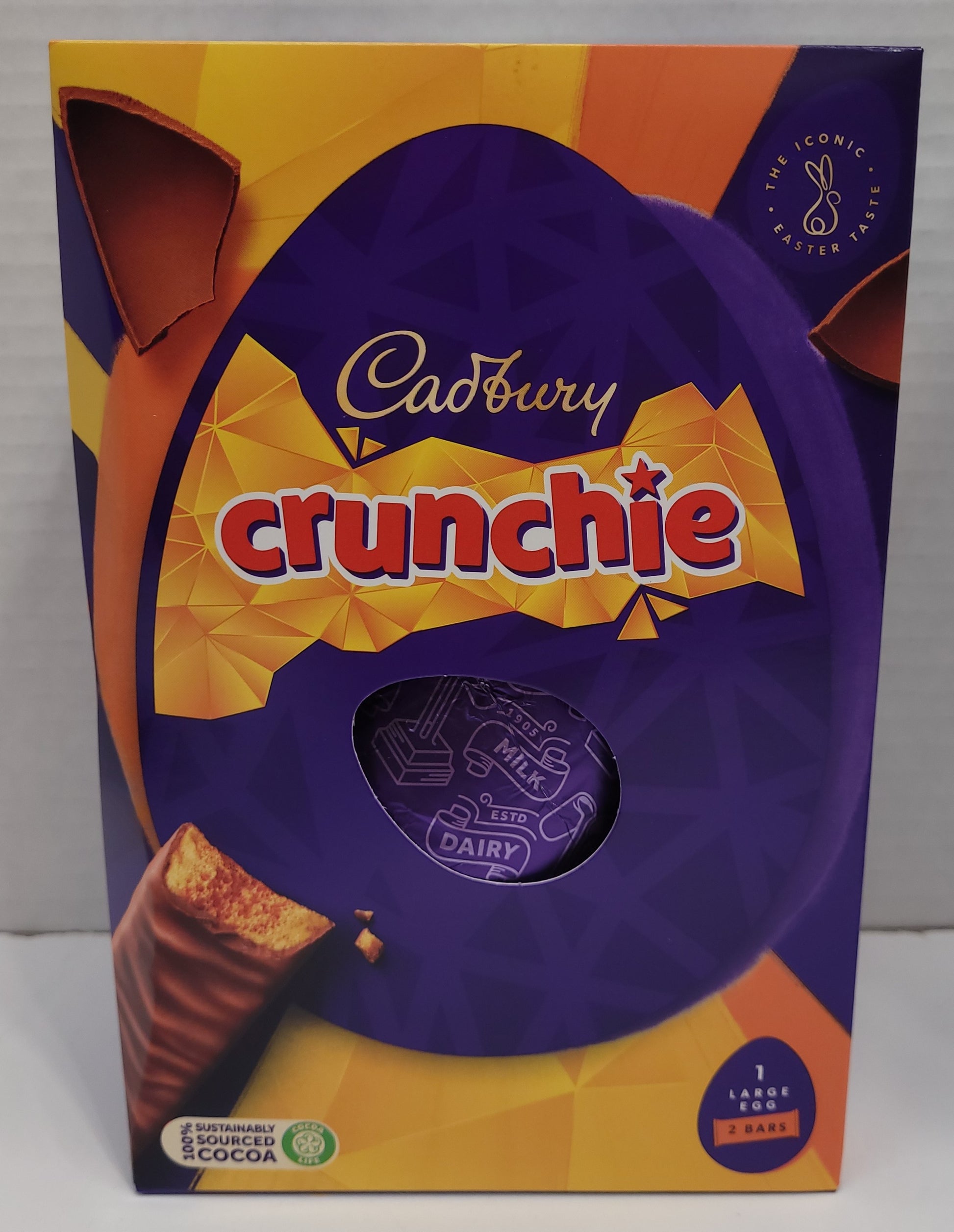 A hollow chocolate egg made with the world-famous Cadbury Dairy Milk chocolate and filled with two Cadbury Crunchie bars.   Bright festive packaging  perfect for the holiday!    Contents: One hollow chocolate egg and two bars of honeycombed milk chocolate.  Size: 190g.   Imported from the UK