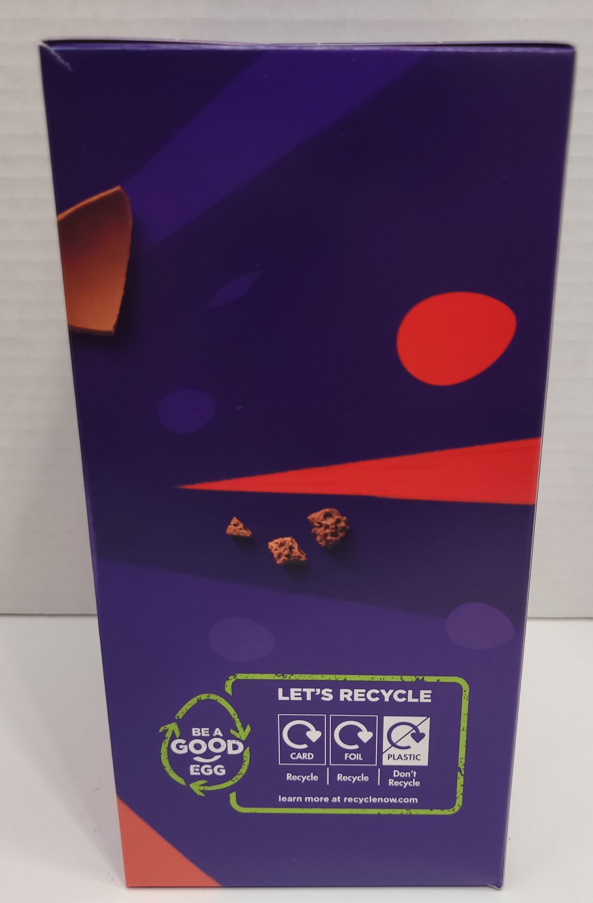 Side view of Box - A yummy hollow chocolate egg made with the world-famous Cadbury Dairy Milk chocolate. The chocolate egg is filled with 1 Cadbury Wispa chocolate bar.   Box contains one Cadbury Dairy Milk hollow chocolate egg and two bars of textured milk chocolate.   152G   Imported from the UK. 
