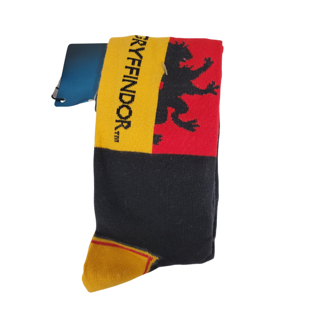 Snuggle up next to a warm fire on your next camping trip with this Harry Potter camping mug and cozy socks. The Harry Potter Gryffindor Quidditch mug and socks set is the perfect duo for any Harry Potter fans. Show your Gryffindor pride with this cute set. This cozy set comes with a standard-sized mug and a pair of men's size 7-11 (UK) socks. The tin mug features the Hogwarts crest and the word ‘Quidditch’ on its side, and the socks feature the Gryffindor lion and house’s name.