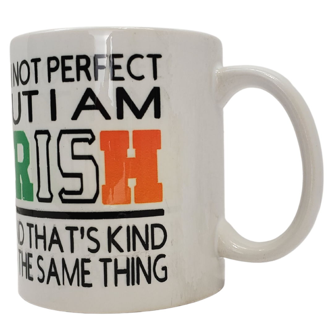 Make your Irish friends smile with our funny coffee mug. Printed on the mug is "I'M NOT PERFECT BUT I AM IRISH AND THAT'S KIND OF THE SAME THING." The lettering for the word Irish features the Ireland flag colours. Standard-sized coffee mug.