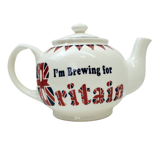 Teapot with festive trianglular Union Jack flags wrapped around the opening. This white teapot has the text "I'm Brewing for Britian" printed on it. The text "I'm brewing for" is in a navy blue colour. The text "Britain" is made from the Union Jack. 