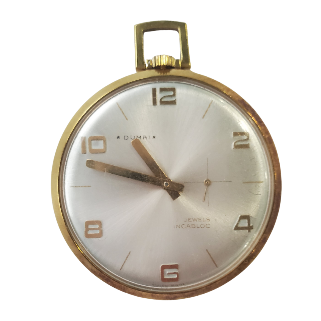 This beautiful piece is a rare find and a must-have for the collector! Dumai gold-filled pocket watch from CIRCA 1970s. 17 jewels Incabloc. Approxamatley 1 1/16th inches in wide.