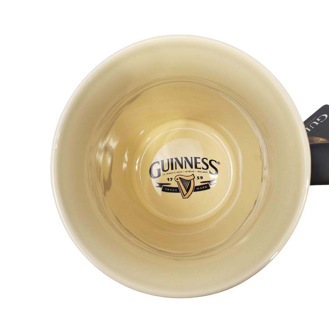 Inside view of mug - Fuel your morning with this official Guinness coffee mug. This stylish mug is sure to be your favourite go-to mug when brewing a cuppa! Designed with the Guinness label it is sure to remind you of Ireland, the home of the black stuff.   Official Guinness Product Ceramic  Microwave and dishwasher safe 
