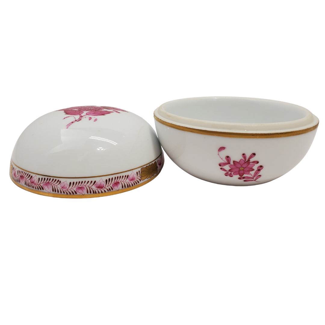 This beautiful Herend Hungary #6032 vintage trinket box is perfect for your vanity. Organize your cotton balls, swabs, or whatever you please. Gorgeous handpainted trinket box with gold touches. Height: 1.46" / 3.7 cm. Diameter: 2.60" / 6.6 cm