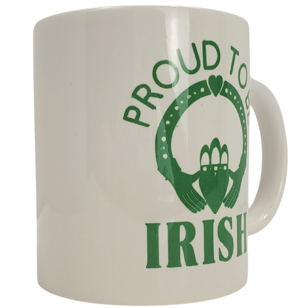 One of Ireland's most recognized images is the Claddagh: Two hands embrace a heart wearing a crown to symbolize the pure love that comes from friendship.  This mug is the perfect gift to give to your Irish friend to show them you cherish your friendship. Featuring the Claddagh and the text "PROUD TO BE IRISH."  Standard sized coffee mug. 