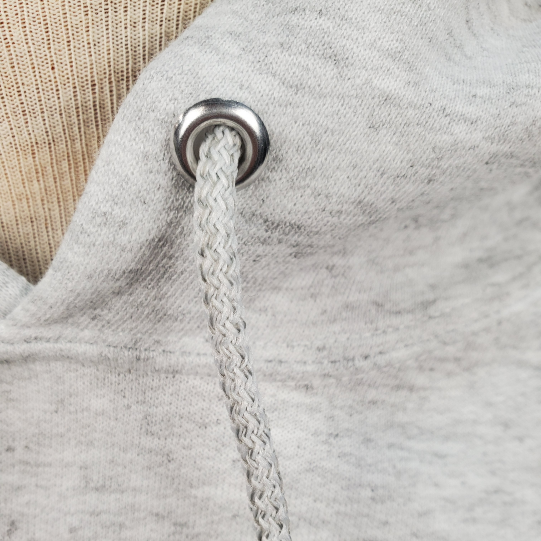 Close up view of String - The Union Jack is the new black. This soft comfortable hooded sweater is perfect for those cooler nights. Stay cozy while representing your U.K. pride with this embroidered sweater.