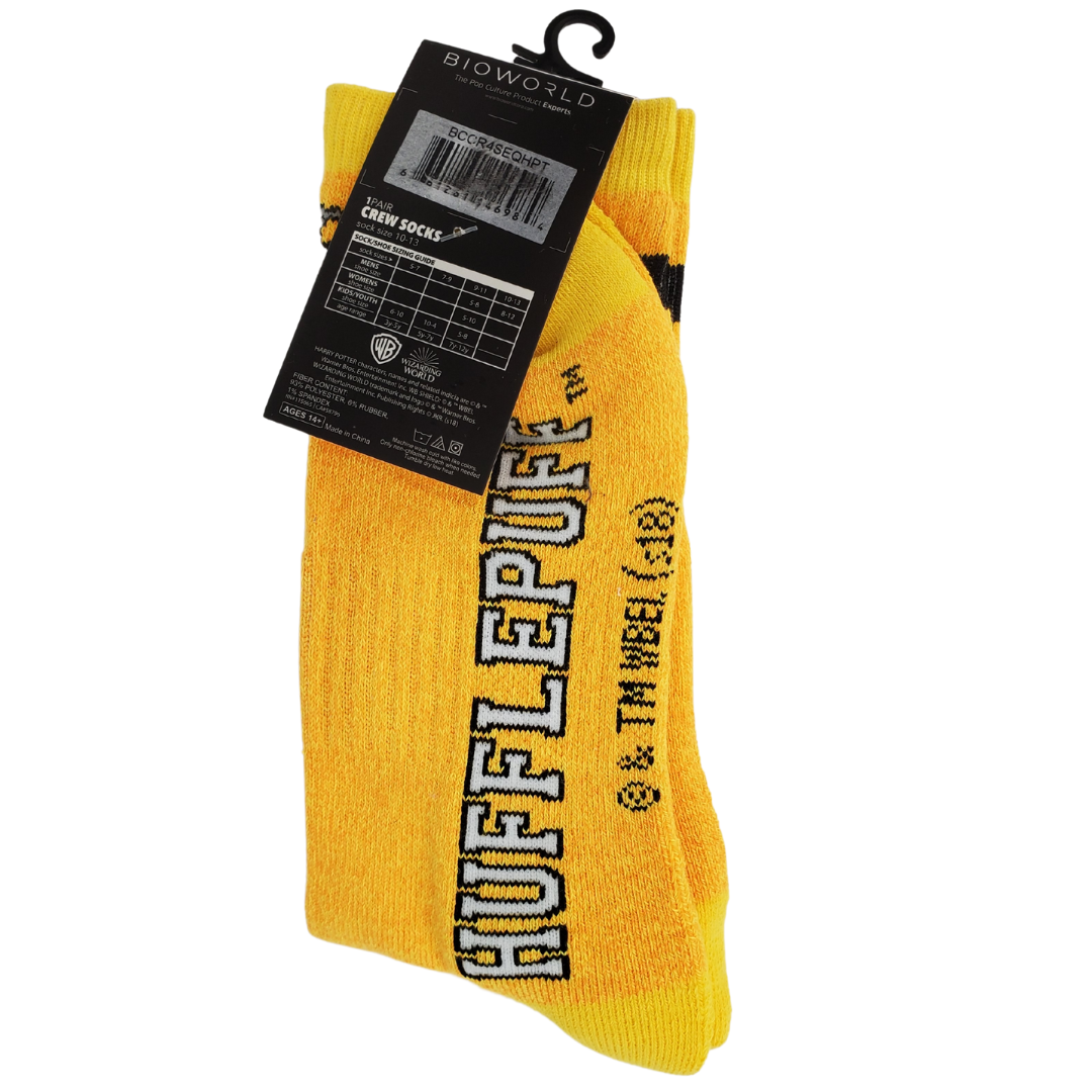 Slide into these Hufflepuff socks and keep your toes nice and warm. These Harry Potter Hufflepuff school crest crew socks are nice and soft. They are in the traditional Hufflepuff yellow and black and feature the house crest and the text "HUFFLEPUFF" on the side.  Size 10-13. 
