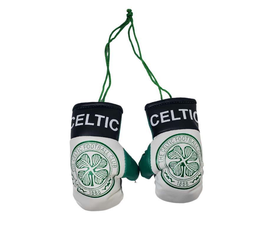 A set of miniature boxing gloves tied together with a green string. Offical celtic merchandise. White gloves with the official celtic logo and a black band around the wrist with white text reading "Celtic."