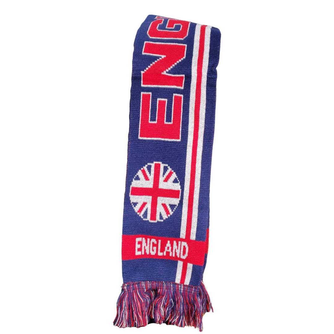 Stay warm when you are bundled up in this soft England scarf. This scarf has the beautiful deep blue, ruby red and white colour combination of the Union Jack. This long scarf has the text "ENGLAND" written across the length. At the ends are circular Union Jack flags and below them is the text "ENGLAND".
