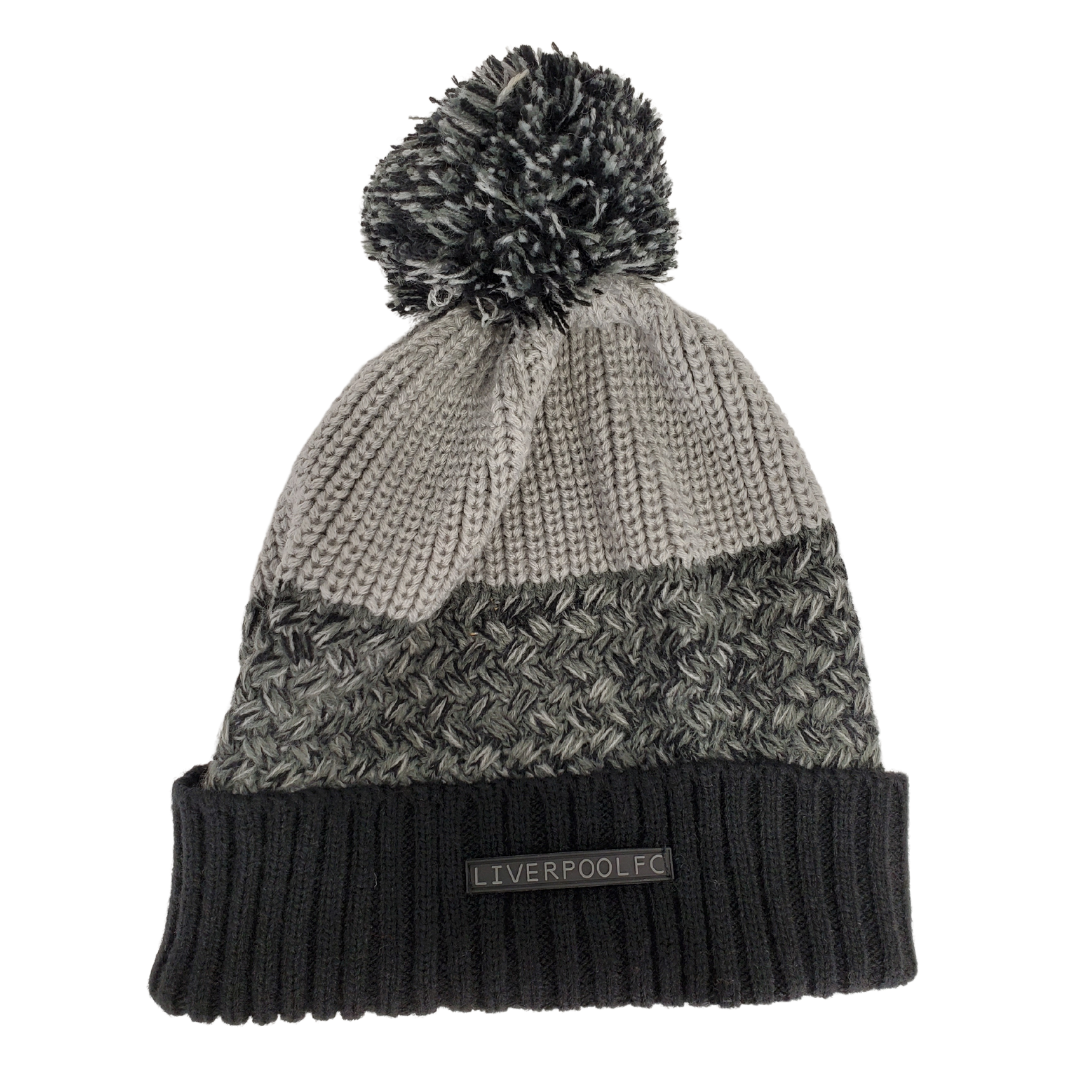 Stay warm in this cozy official Liverpool FC cuffed knitted toque.  This toque features a fun pom on top and striking heathered fabric. The cold weather will not prevent you from showing off team loyalty! One size fits most with the soft stretch fit fabric. 