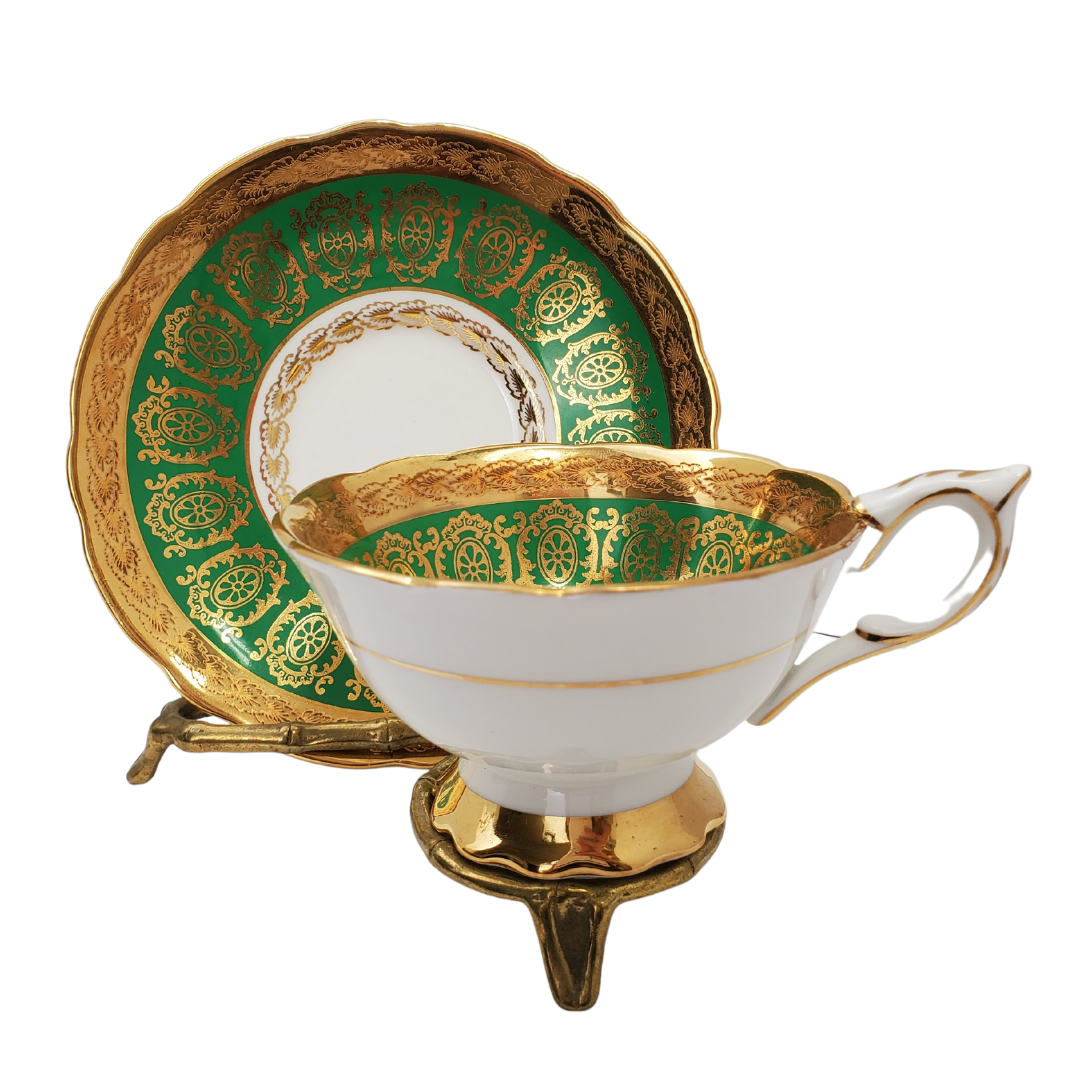 Gorgeous emerald and gold Royal Stafford fine china tea set. Beautiful intricate gold design, with emerald green. Floral elements. No cracks, scratches, or chips. In great condition.
