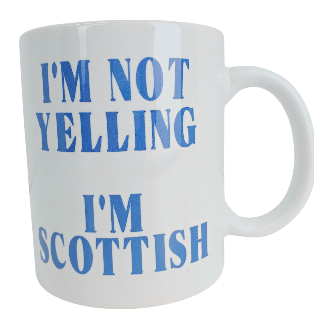 Make your Scottish friends laugh with our Scottish coffee mug. This mug features the text "I'm not yelling I'm Scottish" on one side. The other side is plain white. Standard sized coffee mug.