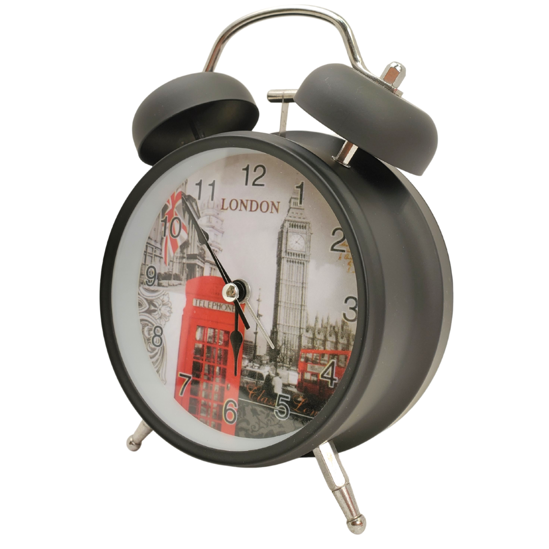 This classic-looking alarm clock with a British twist is ideal for the bedside. Large print numbers,  super loud alarm will make sure you're never late for work again!  Metal material, glass lens, and cute little feet. Battery operated Battery not included 