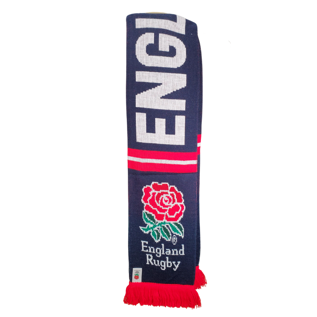 Whether you're cheering from the stands or just need to keep warm in the cold this scarf is ideal. The England Rugby decoration means your pride will be on display wherever you go. This gorgeous knit scarf is perfect for the rugby fan in your life. This scarf features the England rubgy logo at each end and the text "ENGLAND" along the length. 