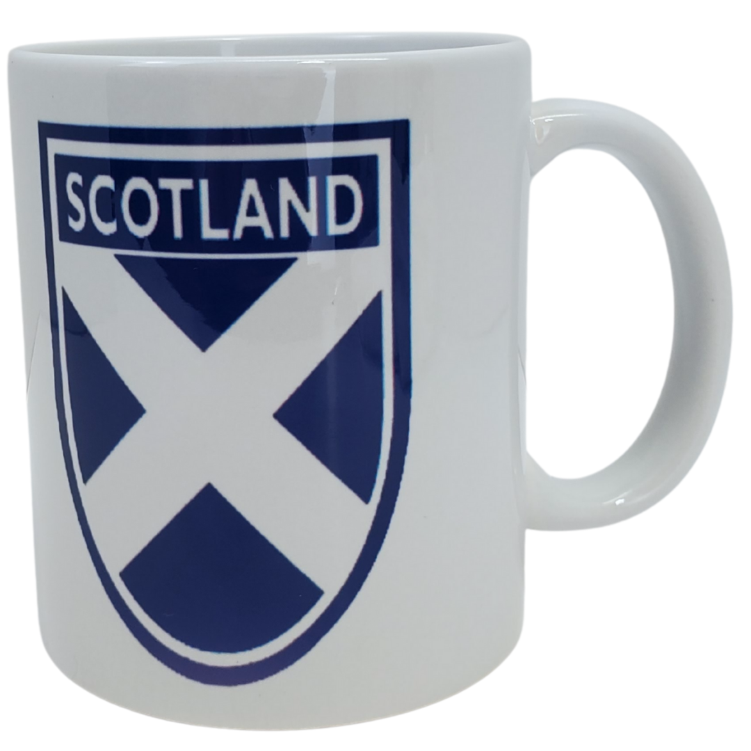 Show off your Scottish pride with our Scottish flag coffee mug. This mug features the Scottish flag in a crest. Features the text "SCOTLAND" in a crest on both sides of the mug along with the Scottish Flag. Standard-sized coffee mug.