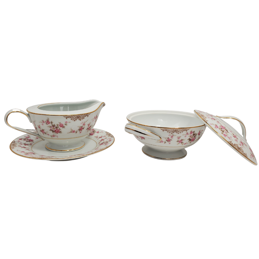 Gorgeous RC milker and sugar bowl set. Beautiful floral design with gold trim. No scratches, chips or cracks.