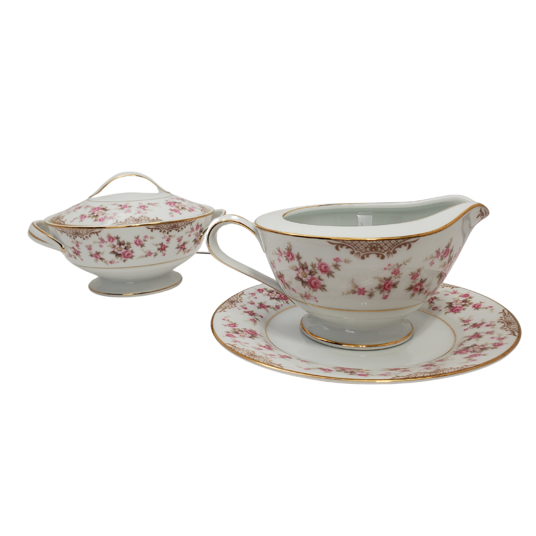 Gorgeous RC milker and sugar bowl set. Beautiful floral design with gold trim. No scratches, chips or cracks.