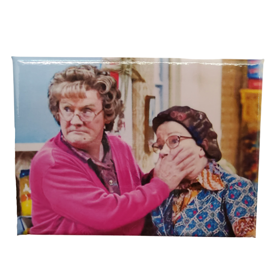 Magenet View - You're going to feckin' love this coffee mug! This coffee mug is perfect for the Mrs.Brown's boys fans! Featuring an image of Mrs.Brown covering the mouth of her counterpart. Standard-sized coffee mug.   EXTRA BONUS: Get the matching magnet for only $2.99 with purchase of mug!