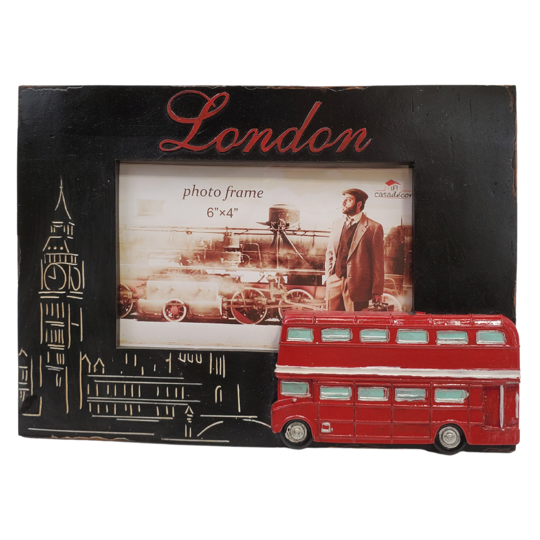 Give your pictures a touch of London with this London-themed picture frame. Perfect for any travel photos you would like to display! 9 x 0.8 x 6.5-inch photo frame is made of durable polyresin material. The frame is engraved with a bright red London on the top and features Big Ben on the left of the frame and a bright red 3D double-decker bus to the lower right. The frame holds a photo with 6 x 4" dimensions. 