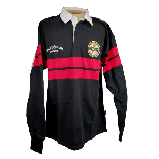 Black long sleeved rugby shirt with a white collar. Two red bads span across the chest and arms. There is an official Guinness patch on the left breast. There is embroidered white text on the right breast. 