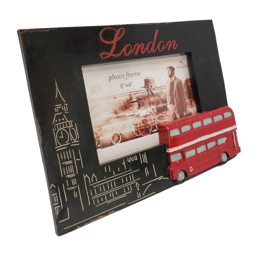 Give your pictures a touch of London with this London-themed picture frame. Perfect for any travel photos you would like to display! 9 x 0.8 x 6.5-inch photo frame is made of durable polyresin material. The frame is engraved with a bright red London on the top and features Big Ben on the left of the frame and a bright red 3D double-decker bus to the lower right. The frame holds a photo with 6 x 4" dimensions. 