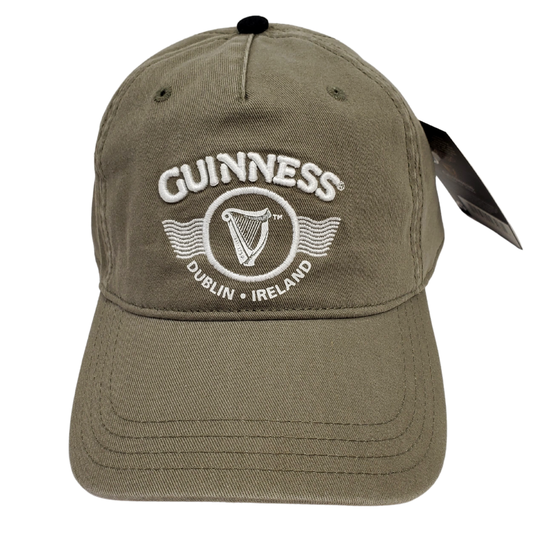 Army green Guinness ballcap. Has the text "GUINNESS" in the center. Below the text is the famous Guinness harp enclosed in a circle. Below the harp is the text "DUBLIN IRELAND" that curves along the bottom of the circle the harp is enclosed in.  