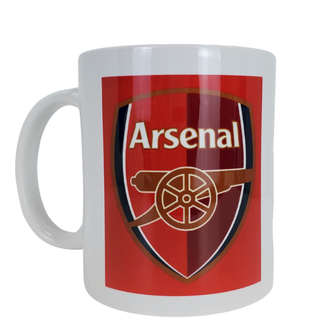 White coffee mug with a red background featuring the Arsenal football crest. 