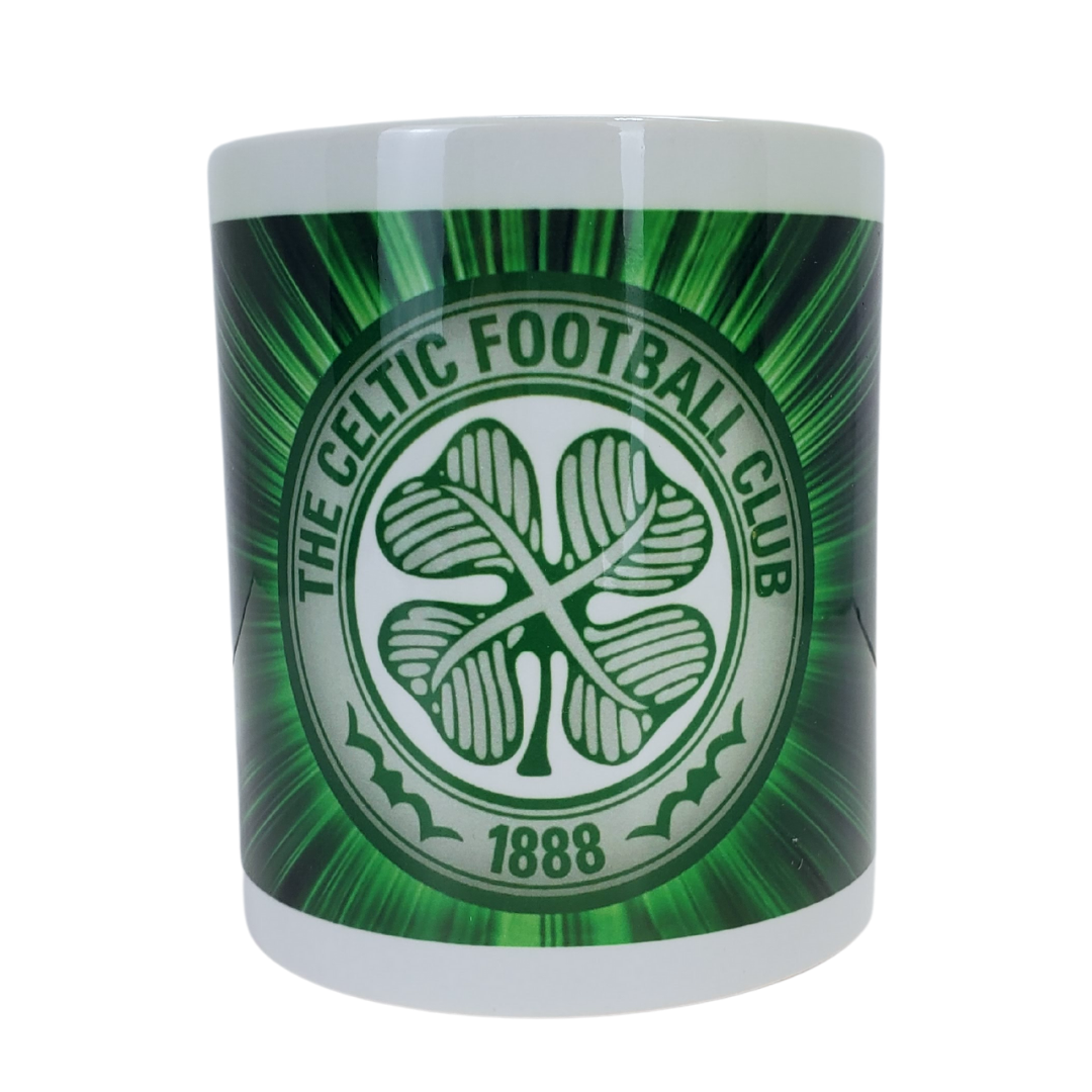 White coffee mug with a green background with the Celtic Football Club logo. 
