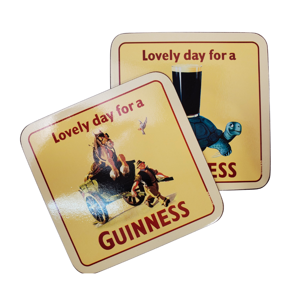 Stack of six Guinness coasters. The coaster on the top features a horse in a cart that is being carried by a man with a smile on his face. The text says "Lovely day for a Guinness." 