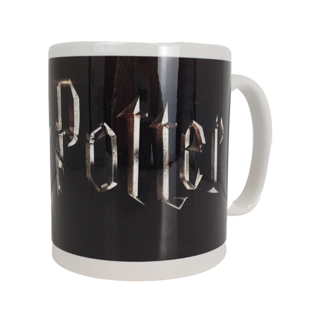 Snuggle up with a warm cuppa while watching the marvelous magical world of Harry Potter with your own Harry Potter themed coffee mug.  Care Instructions: Dishwasher and microwave safe.