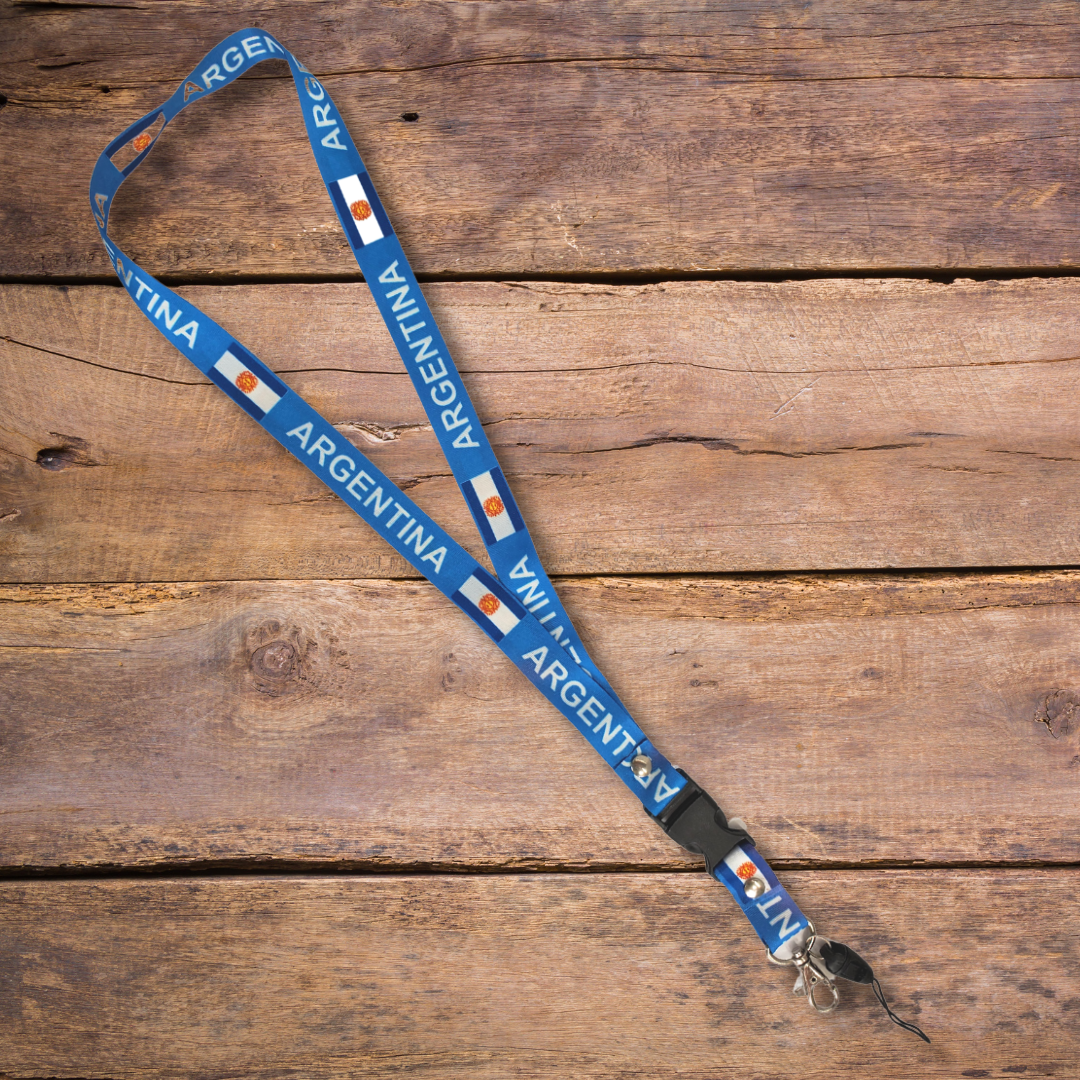 Show off your Argentine heritage all while keeping your keys secured! Never lose your keys again with this stylish Argentina keychain lanyard. It showcases the beautiful national flag and the text "ARGENTINA." Comes with a metal clip as well as a fabric loop to secure an ID badge.