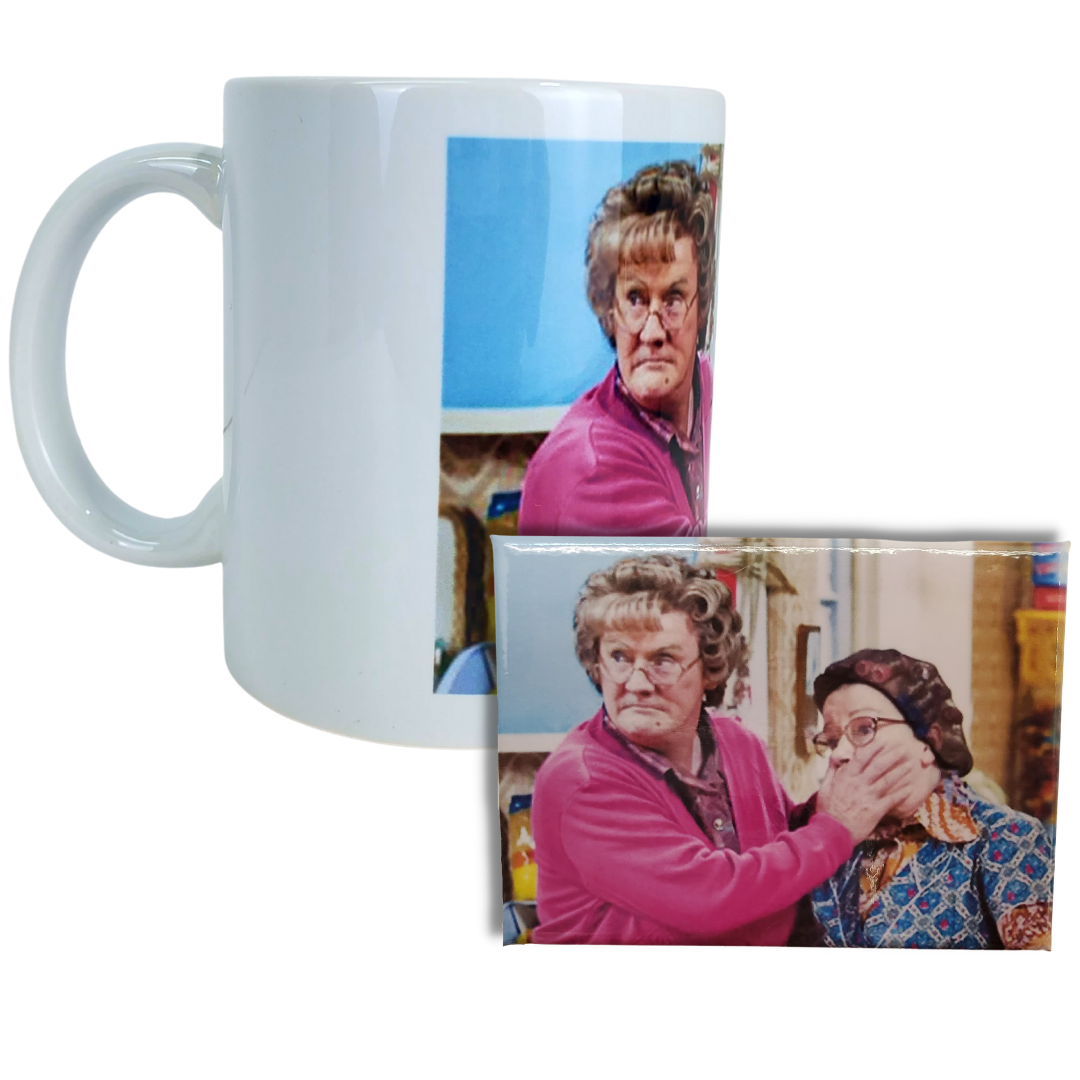 Mug and Magnet Combo view - You're going to feckin' love this coffee mug! This coffee mug is perfect for the Mrs.Brown's boys fans! Featuring an image of Mrs.Brown covering the mouth of her counterpart. Standard-sized coffee mug.   EXTRA BONUS: Get the matching magnet for only $2.99 with purchase of mug!